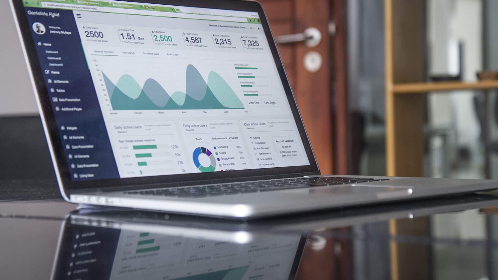 An open laptop displaying advertising analytics dashboards - the daily ritual every contractor running Google Local Services Ads gets familiar with.