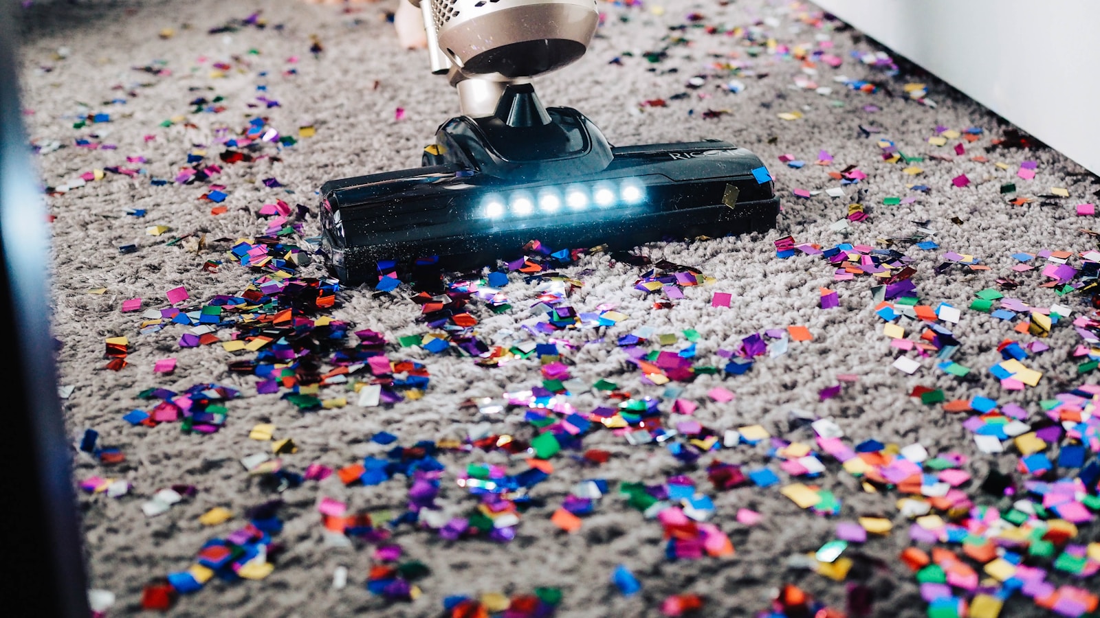 Cleaning supplies and microfiber cloths arranged on a wood surface - the daily inventory of a residential cleaning route.